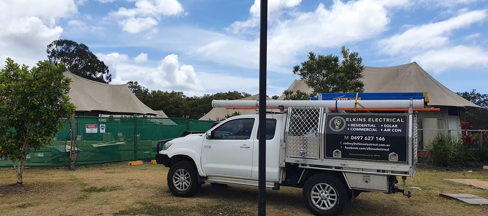 Elkins Electrical work ute with its signed canopy, parked on a job site